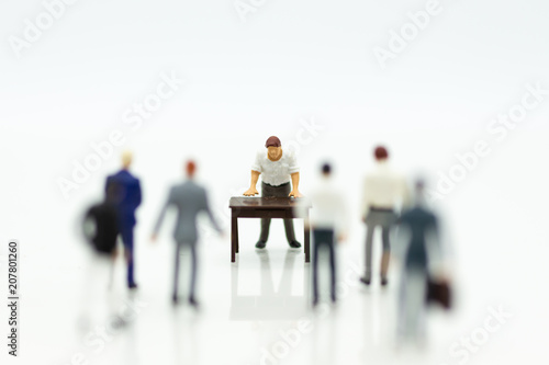 Miniature people : Men are being blamed for wrongdoing. Image use for admonition, reprimand, emotional expression.