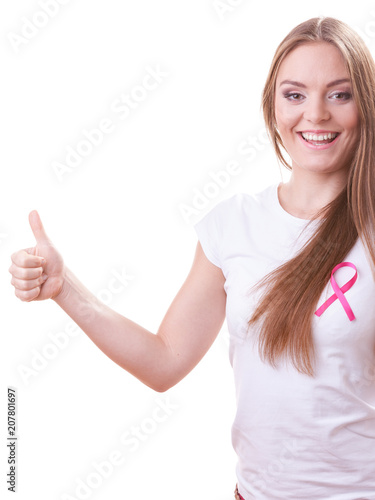 woman pink cancer ribbon on chest making thumb up