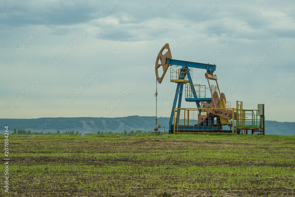 well for oil production, drilling rig pump. well for oil production, drilling rig pump.