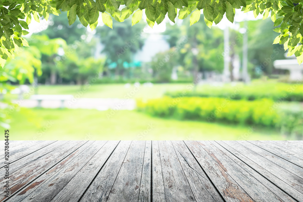 Empty wooden table with party in garden background blurred. Empty wooden table with party in garden background blurred.