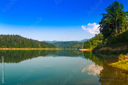     Beautiful mountain landscape in Croatia  Lokvarsko lake with Risnjak mountain in background  reflection  Lokve  Gorski kotar  Croatia 