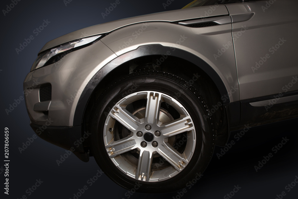 Naklejka premium Hood and tires of modern car.