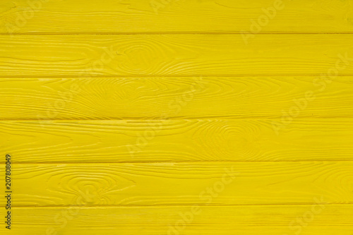 Brushed wood texture with yellow color background