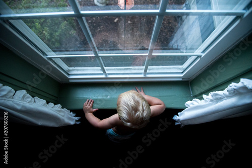 Child Looking out Window
