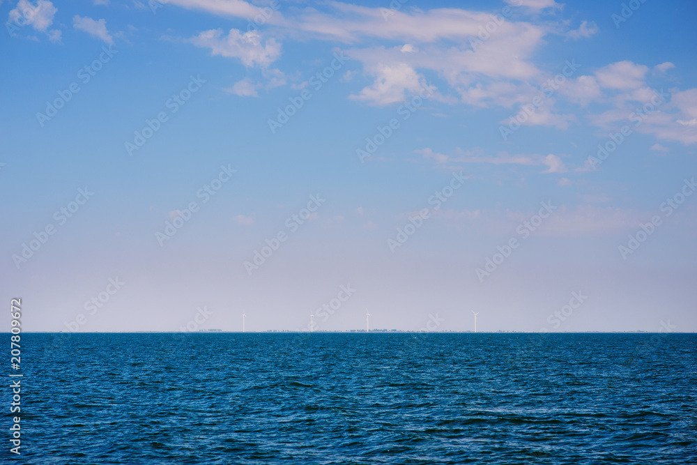 the blue ocean with dull clouds on a lovely sunny day the blue ocean with dull clouds on a lovely sunny day