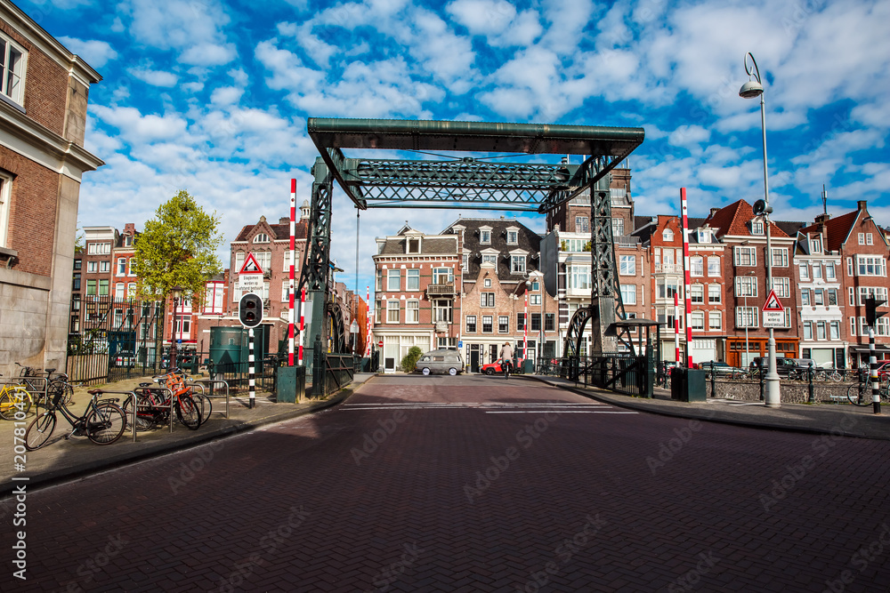 Architecture of Amsterdam with old metal bridge