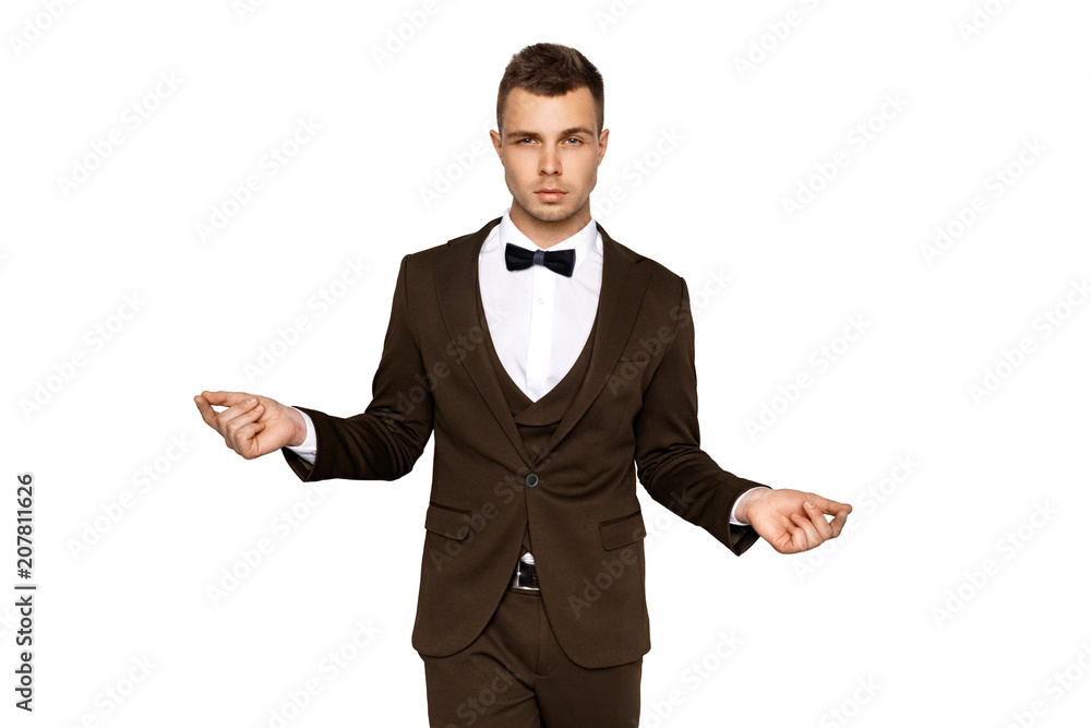 Man in tuxedo and vest in white shirt on white background Man in tuxedo and vest in white shirt on white background