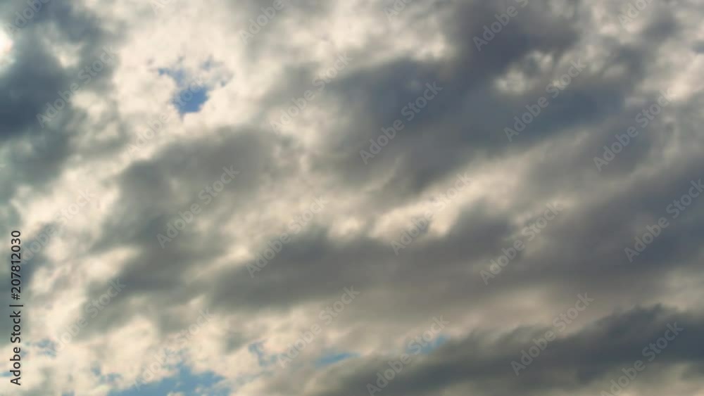Time lapse summer dramatic clouds fly across a bright blue sky. Time lapse summer dramatic clouds fly across a bright blue sky.