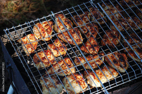 Chicken meat is grilled on the nature.
