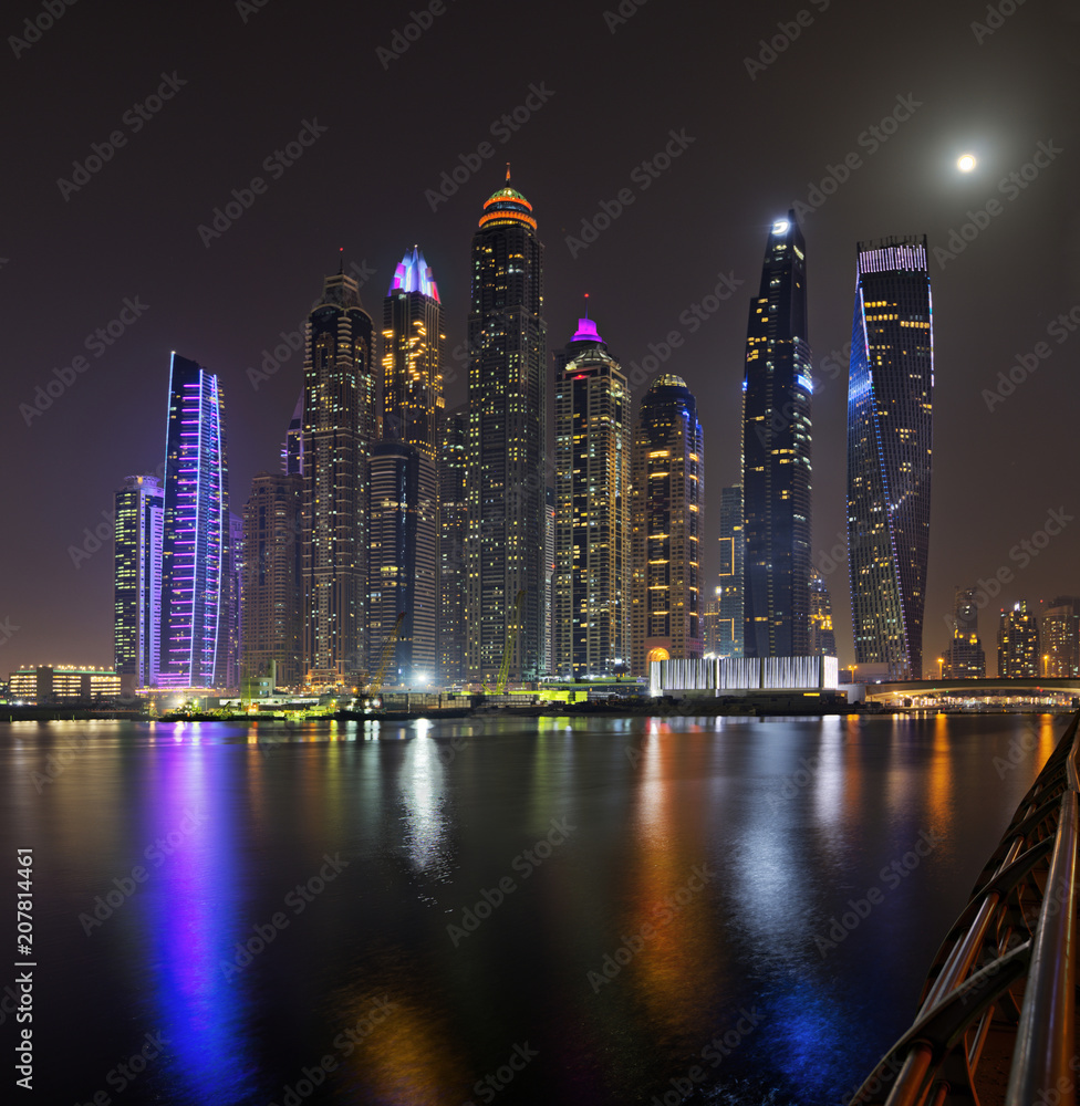 Dubai marina skyscrapers panorama during night hours