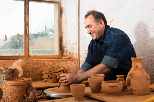 Elderly master at the pottery workshop.