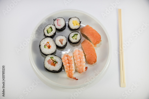 Japanese food Sushi on white plate with japanese chopsticks on white background