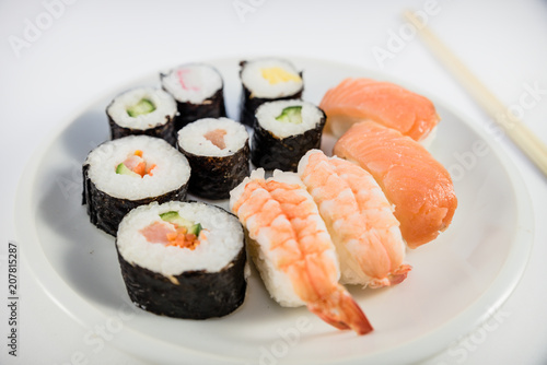 Japanese food Sushi on white plate with japanese chopsticks on white background