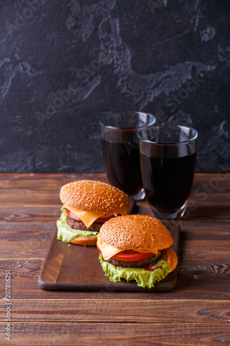 Image of two fresh hamburgers and two glasses of juice