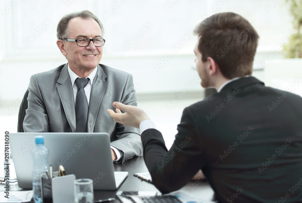 close up.business people talking at a Desk. close up.business people talking at a Desk.