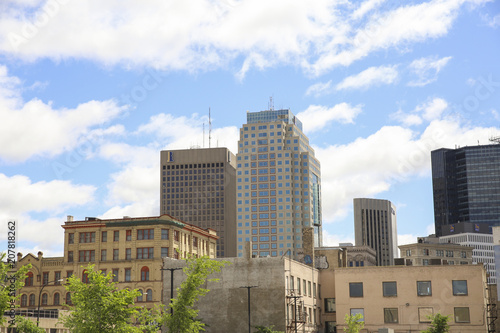 Winnipeg, Manitoba / Canada - June 3, 2018: Winnipeg city scape with cars parked and a blue sky