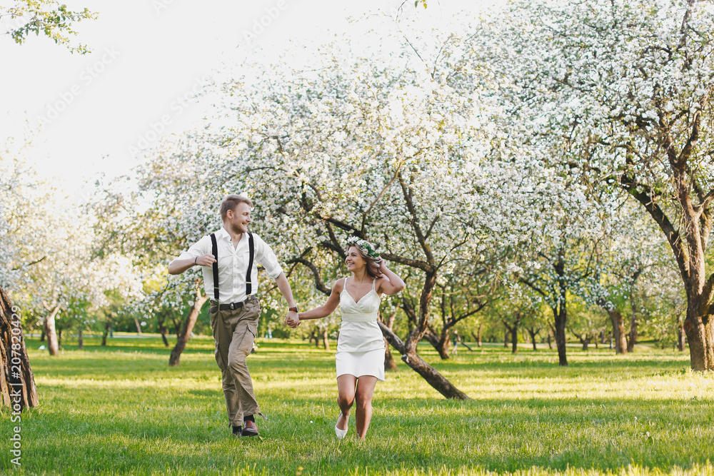 Fototapeta premium Happy couple. Loving couple enjoying in moments of happiness in the park. Love and tenderness, dating, romance. Lifestyle concept