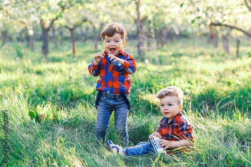 Two cute brother boys tweens having fun outside at sunset in the country © Gorodetskaya