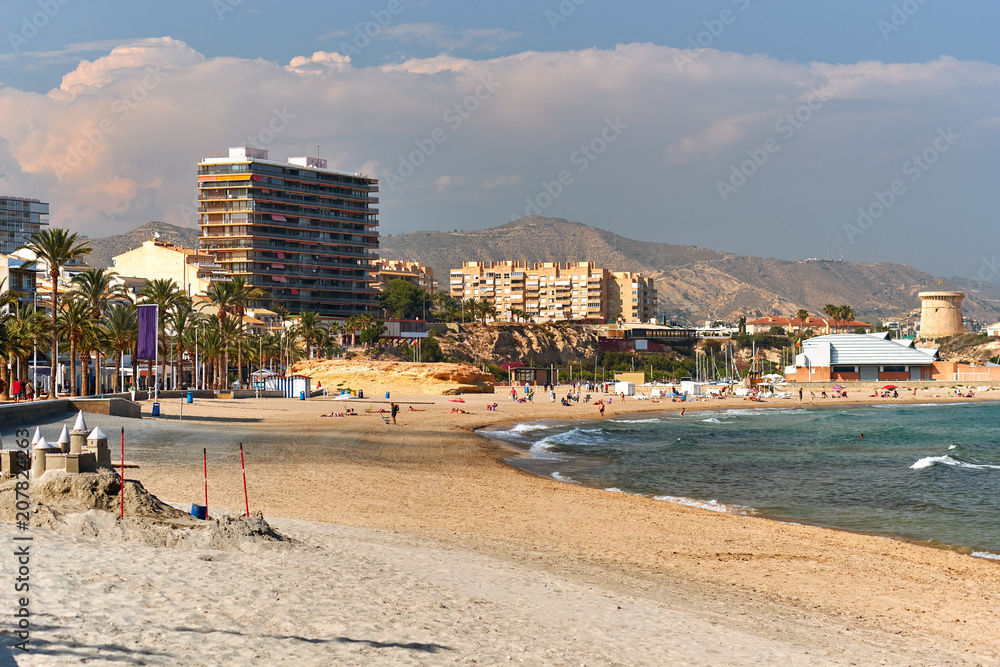 Sandy beach and cityscape El Campello. Alicante, Spain