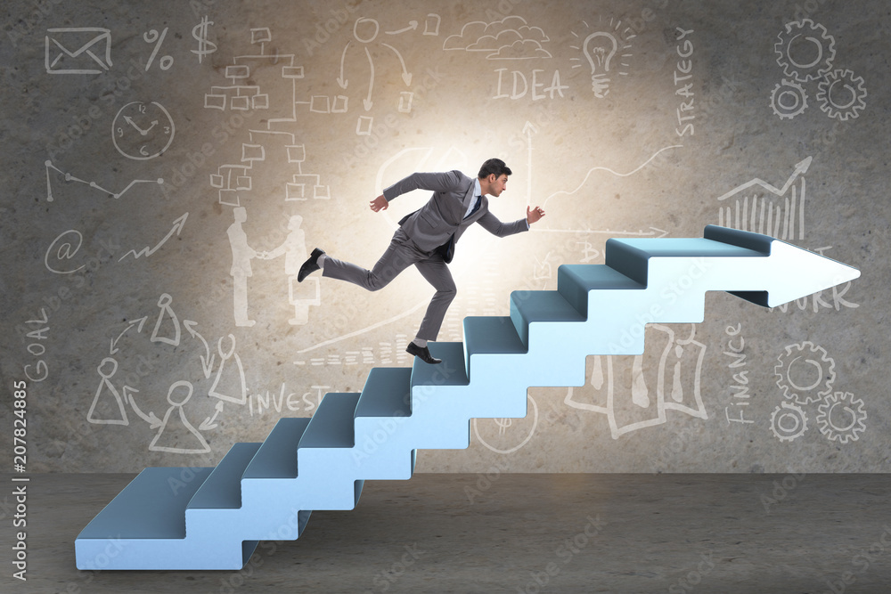 Businessman climbing career ladder in business concept Businessman climbing career ladder in business concept