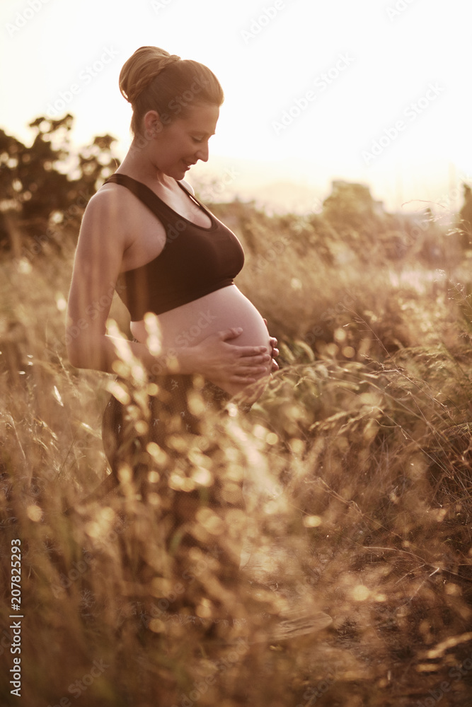 Attractive pregnant woman outdoors Attractive pregnant woman outdoors