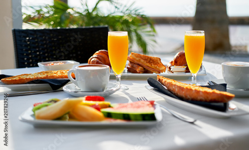 Outdoors restaurant. Table setting with classic breakfast