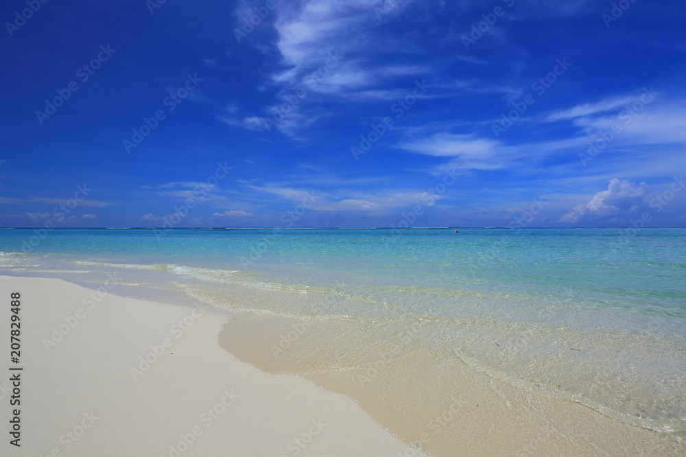 Amazing tropical landscape view. White sand beach , turquoise water and blue sky with white clouds. Gorgeous nature background. Maldives, Indian Ocean. Amazing tropical landscape view. White sand beach , turquoise water and blue sky with white clouds. Gorgeous nature background. Maldives, Indian Ocean.