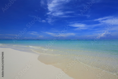 Amazing tropical landscape view. White sand beach , turquoise water and blue sky with white clouds. Gorgeous nature background. Maldives, Indian Ocean.