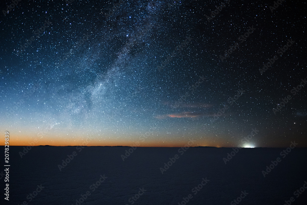 Salar de Uyuni salt flat at starry night before moon rise. Altiplano, Bolivia