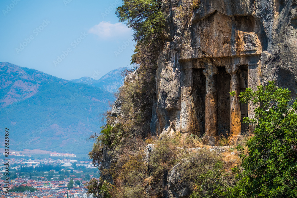 Amyntas rock tombs - 4th BC tombs carved in steep cliff. City of Fethiye, Turkey.