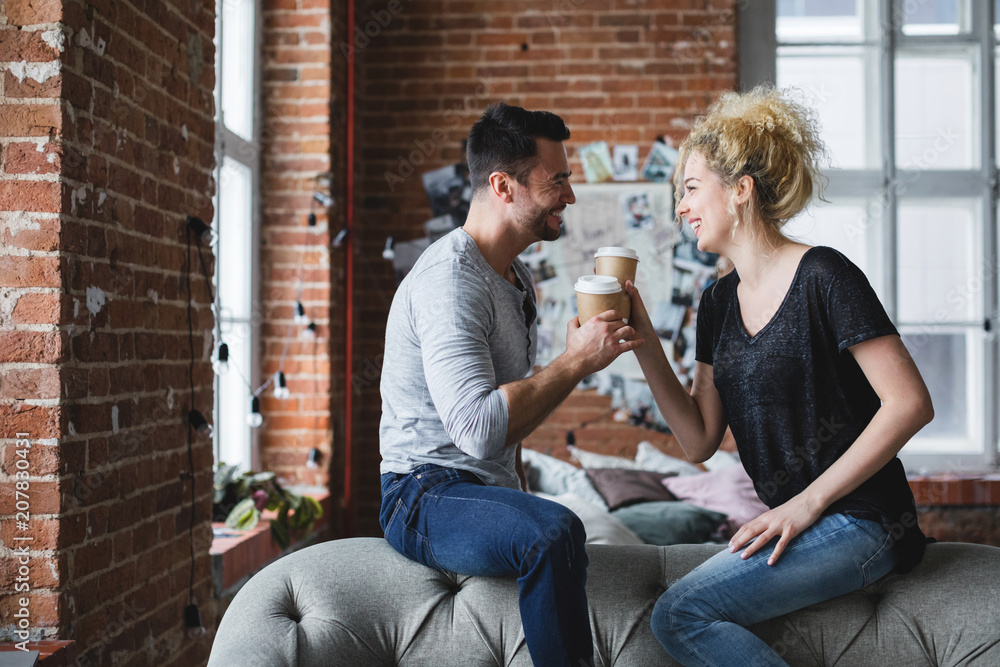 Positive smiling young couple at home. Positive smiling young couple at home.