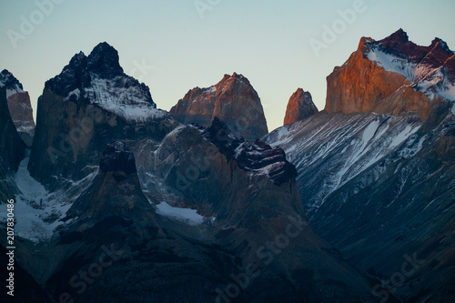 Mountains covered with snow at sunset. Part of mountains of Torres del Paine National Park during sunset, Chile © Dudarev Mikhail