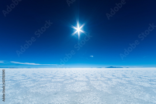 Salar de Uyuni salt flat with salt patterns and blue clear sky. Bolivia © Dudarev Mikhail