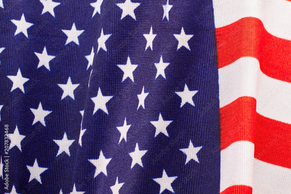 Stars and stripes fabric flag background. Close up cotton flag of United States of America. USA flag wallpaper. Stars and stripes fabric flag background. Close up cotton flag of United States of America. USA flag wallpaper.