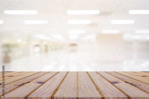 Perspective empty wooden table on top over blur background, can be used mock up for montage products display or design layout. © suthisak