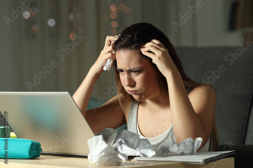 Frustrated student studying on line
