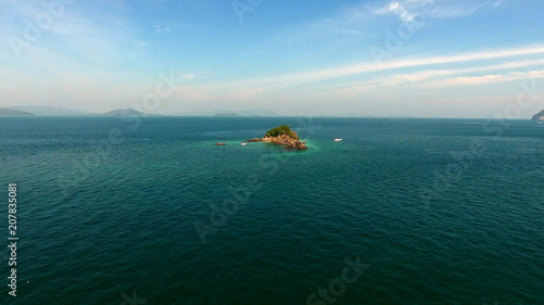 Aerial view, copter flies around the rock in the Indian ocean, near Phuket, thailand