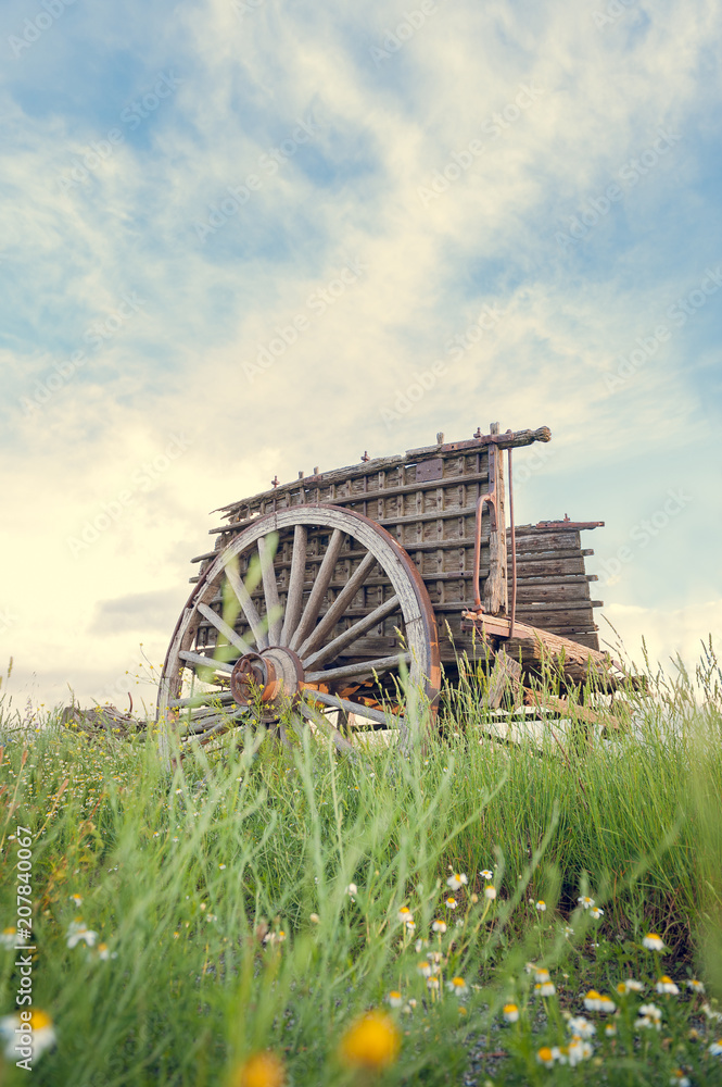 Old wooden trolley in the foreground isolated in its surroundings. Old wooden trolley in the foreground isolated in its surroundings.