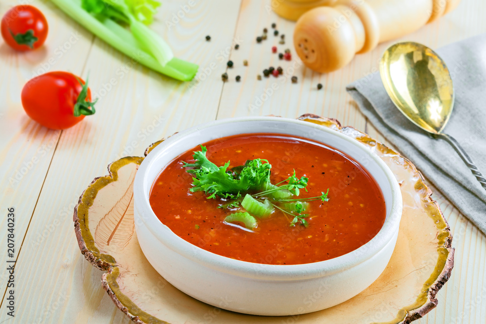 Gazpacho and ingredients on a table, vegetable soup. Delicious Spanish vegan cuisine. Gazpacho and ingredients on a table, vegetable soup. Delicious Spanish vegan cuisine.