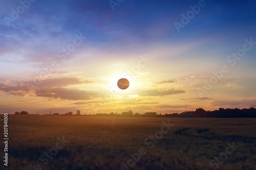 Scientific natural phenomenon. Total solar eclipse with diamond ring effect glowing on sky.