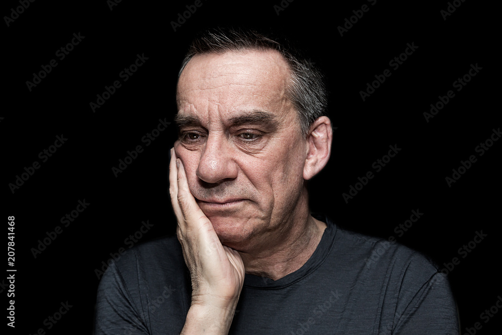 Portrait of Sad Unhappy Man on Black Background Portrait of Sad Unhappy Man on Black Background