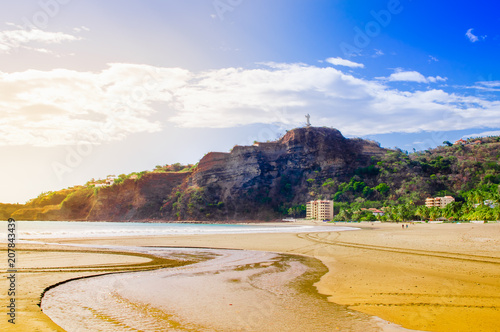 Outdoor view of beachfront scene san juan del sur nicaragua with restaurants and hotels on pacific ocean