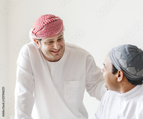 Muslim friends greeting each other photo