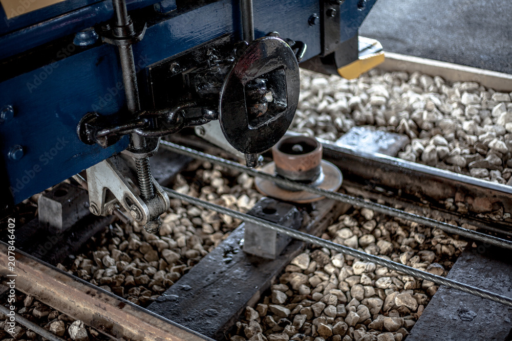 Close view of tram rail front end, showing the spare parts of tramway. Old, vintage, classic, historical technology parts close up photo. Technology, vintage transport concept Close view of tram rail front end, showing the spare parts of tramway. Old, vintage, classic, historical technology parts close up photo. Technology, vintage transport concept