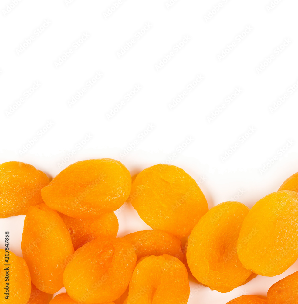 Heap of dried apricots fruit border over white Heap of dried apricots fruit border over white