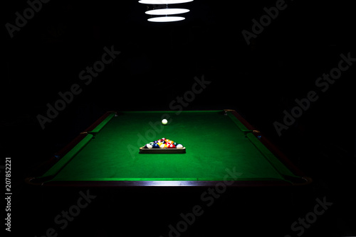 Fotografie Game of billiards on a table with green cloth