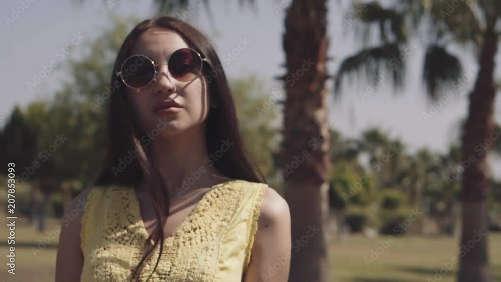 beautiful girl walks on a palm tree beautiful girl walks on a palm tree