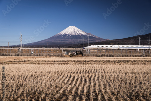 Mountain Fuji and Lake Tanumi with beautiful sunrise in winter season. Lake Tanuki is a lake near Mount Fuji, Japan.  photo