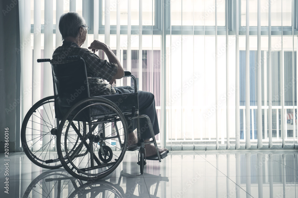 Elderly man looks pensive in the retirement home Elderly man looks pensive in the retirement home