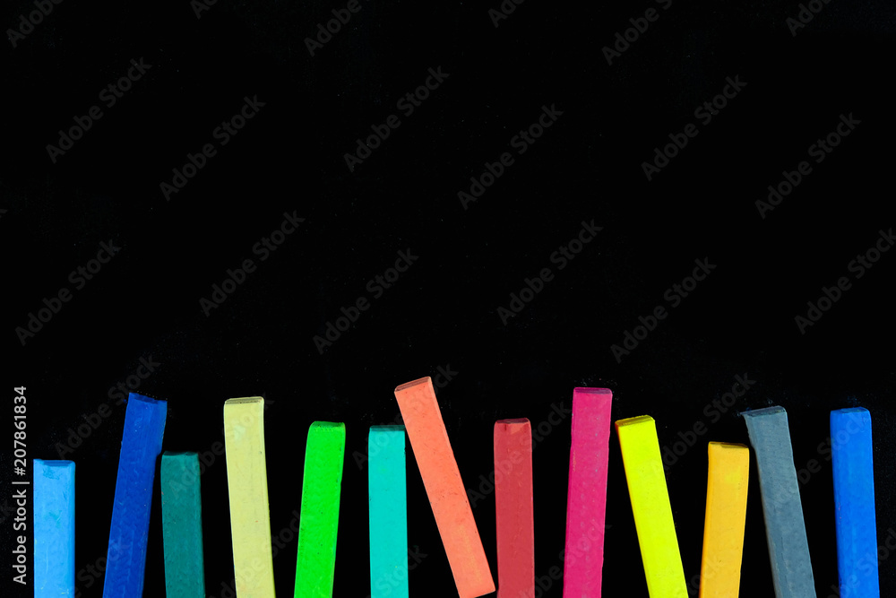 Plakat Colourful chalk pastel on black background, Concept of education background.